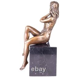 Antique female bronze nude figurine on black marble