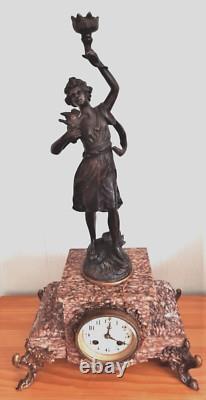 Art Nouveau Mantel Clock, patinated spelter figure with bronze finish on pink marble, signed