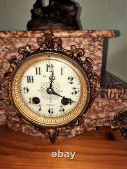Art Nouveau Mantel Clock, patinated spelter figure with bronze finish on pink marble, signed