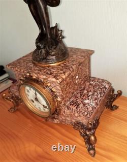 Art Nouveau Mantel Clock, patinated spelter figure with bronze finish on pink marble, signed