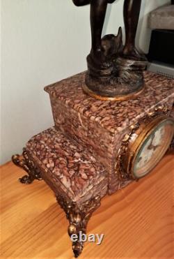 Art Nouveau Mantel Clock, patinated spelter figure with bronze finish on pink marble, signed