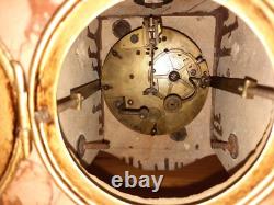 Art Nouveau Mantel Clock, patinated spelter figure with bronze finish on pink marble, signed