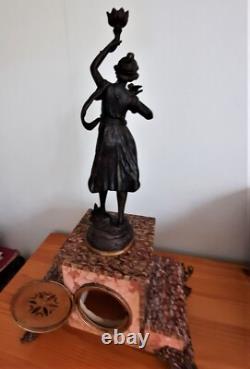 Art Nouveau Mantel Clock, patinated spelter figure with bronze finish on pink marble, signed