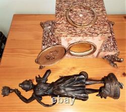 Art Nouveau Mantel Clock, patinated spelter figure with bronze finish on pink marble, signed