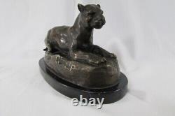 Bronze Lying Panther, signed BARYE on marble pedestal.
