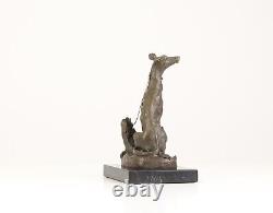 Bronze Sculpture of a Greyhound Sitting on a Black Marble