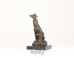 Bronze Sculpture of a Greyhound Sitting on a Black Marble