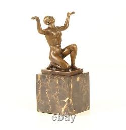 Bronze Sculpture of a Kneeling Male Nude on Black Marble