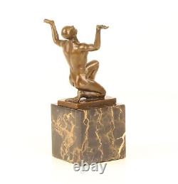 Bronze Sculpture of a Kneeling Male Nude on Black Marble