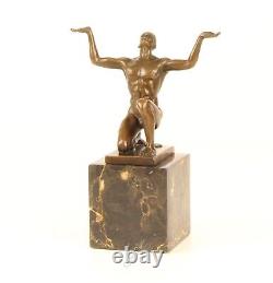 Bronze Sculpture of a Kneeling Male Nude on Black Marble