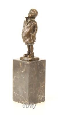 Bronze Sculpture of a Little Boy on a Black Marble