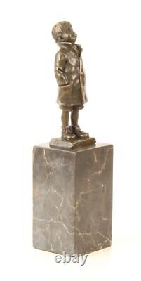 Bronze Sculpture of a Little Boy on a Black Marble