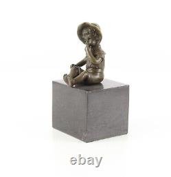 Bronze Sculpture of a Little Girl on Black Marble