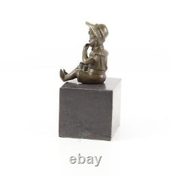 Bronze Sculpture of a Little Girl on Black Marble