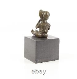 Bronze Sculpture of a Little Girl on Black Marble