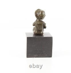 Bronze Sculpture of a Little Girl on Black Marble