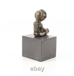 Bronze Sculpture of a Little Girl on Black Marble