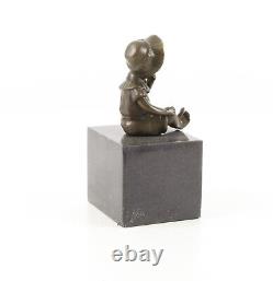 Bronze Sculpture of a Little Girl on Black Marble