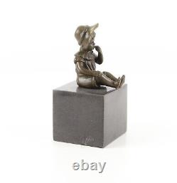 Bronze Sculpture of a Little Girl on Black Marble