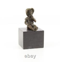 Bronze Sculpture of a Little Girl on Black Marble