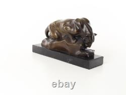 Bronze cougar statue by the pool on a black marble base, signed