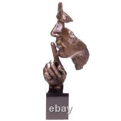 Bronze face statue on a marble base after Dali