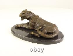 Bronze leopard sculpture on a black marble base after Milo