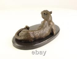Bronze leopard sculpture on a black marble base after Milo