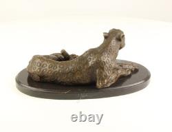 Bronze leopard sculpture on a black marble base after Milo