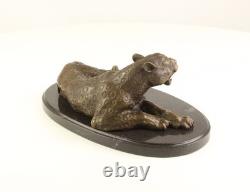 Bronze leopard sculpture on a black marble base after Milo