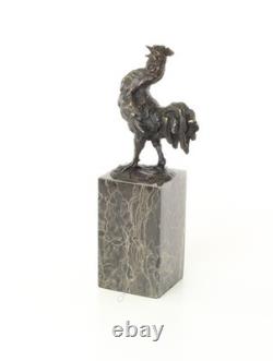 Bronze rooster sculpture on a black marble base, signed
