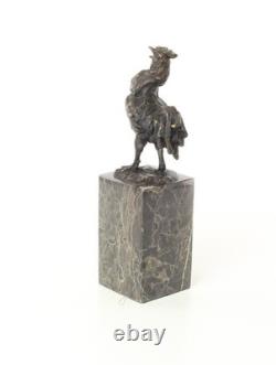 Bronze rooster sculpture on a black marble base, signed