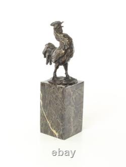 Bronze rooster sculpture on a black marble base, signed