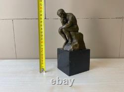 Bronze sculpture The Thinker on black marble after Auguste Rodin