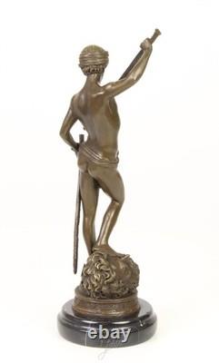 Bronze sculpture of David on a black marble base after Antonin Mercier
