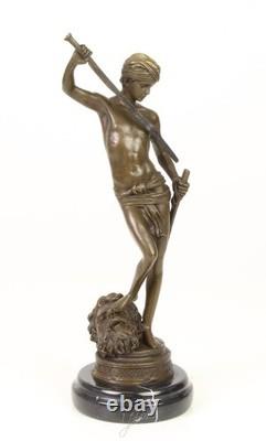 Bronze sculpture of David on a black marble base after Antonin Mercier