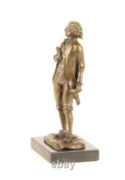 Bronze sculpture of Frédéric Chopin on a black marble pedestal after Milo