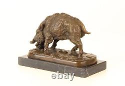 Bronze sculpture of a Wild Boar on a black marble, signed