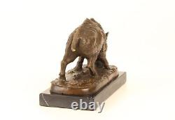 Bronze sculpture of a Wild Boar on a black marble, signed