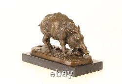 Bronze sculpture of a Wild Boar on a black marble, signed