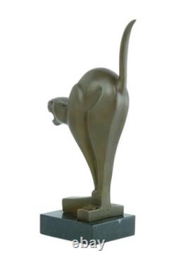 Bronze sculpture of a cat on a marble base after Chris van der Hoef