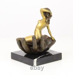 Bronze sculpture of a hand holding a woman on a marble base after Juno