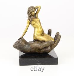 Bronze sculpture of a hand holding a woman on a marble base after Juno