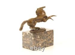 Bronze sculpture of a modern harnessed horse on a marble base, signed