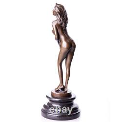 Bronze sculpture of a naked woman on a black marble pedestal Signed