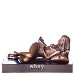 Bronze sculpture of a nude woman with a book on black marble Signed