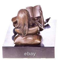 Bronze sculpture of a nude woman with a book on black marble Signed