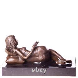 Bronze sculpture of a nude woman with a book on black marble Signed