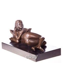 Bronze sculpture of a nude woman with a book on black marble Signed