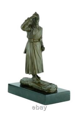 Bronze sculpture of a soldier on skis on a black marble base signed